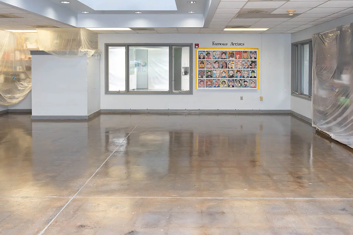 Same room with the slab stained and sealed to a warm sheen