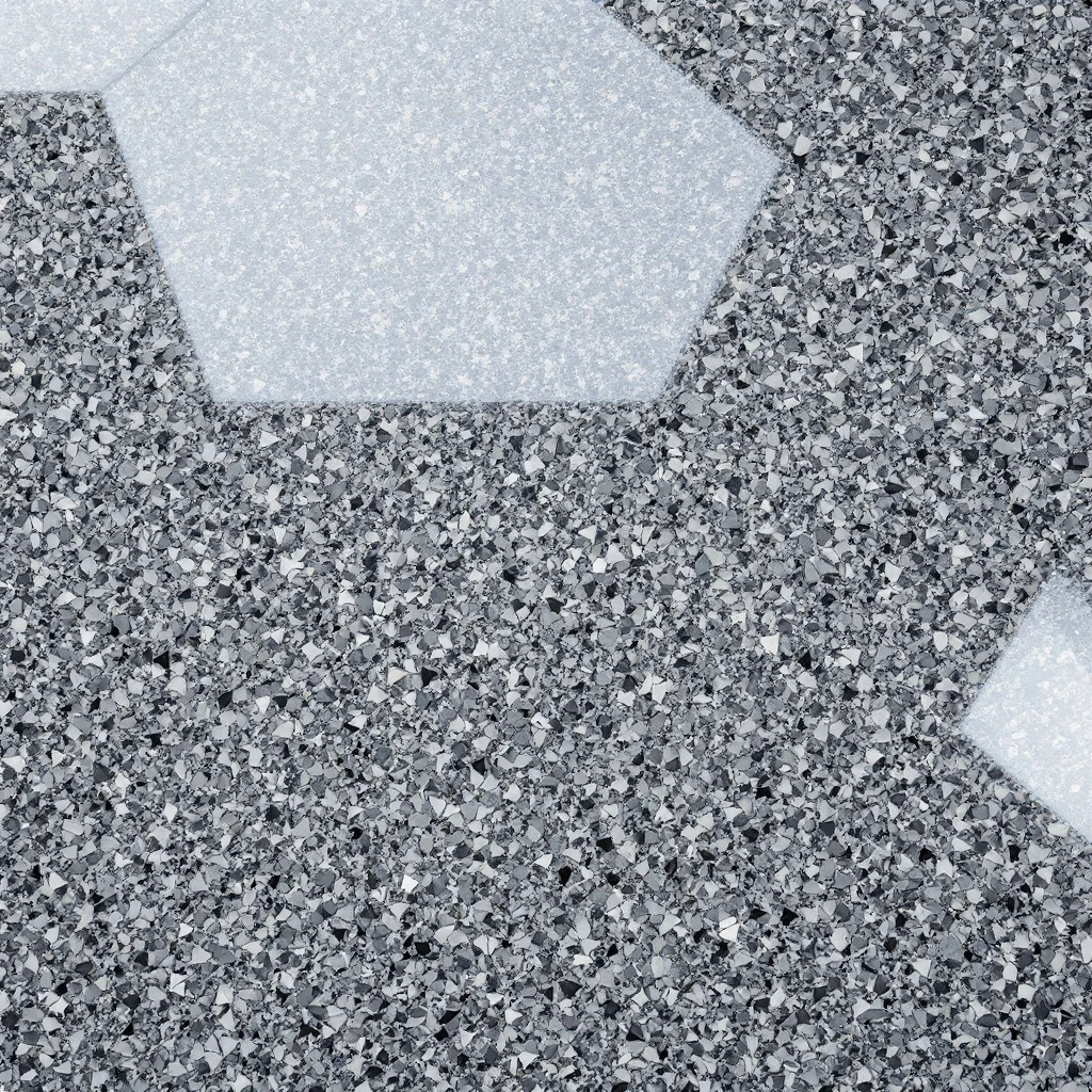 Macro of a finished gray flake floor under glossy polyaspartic topcoat